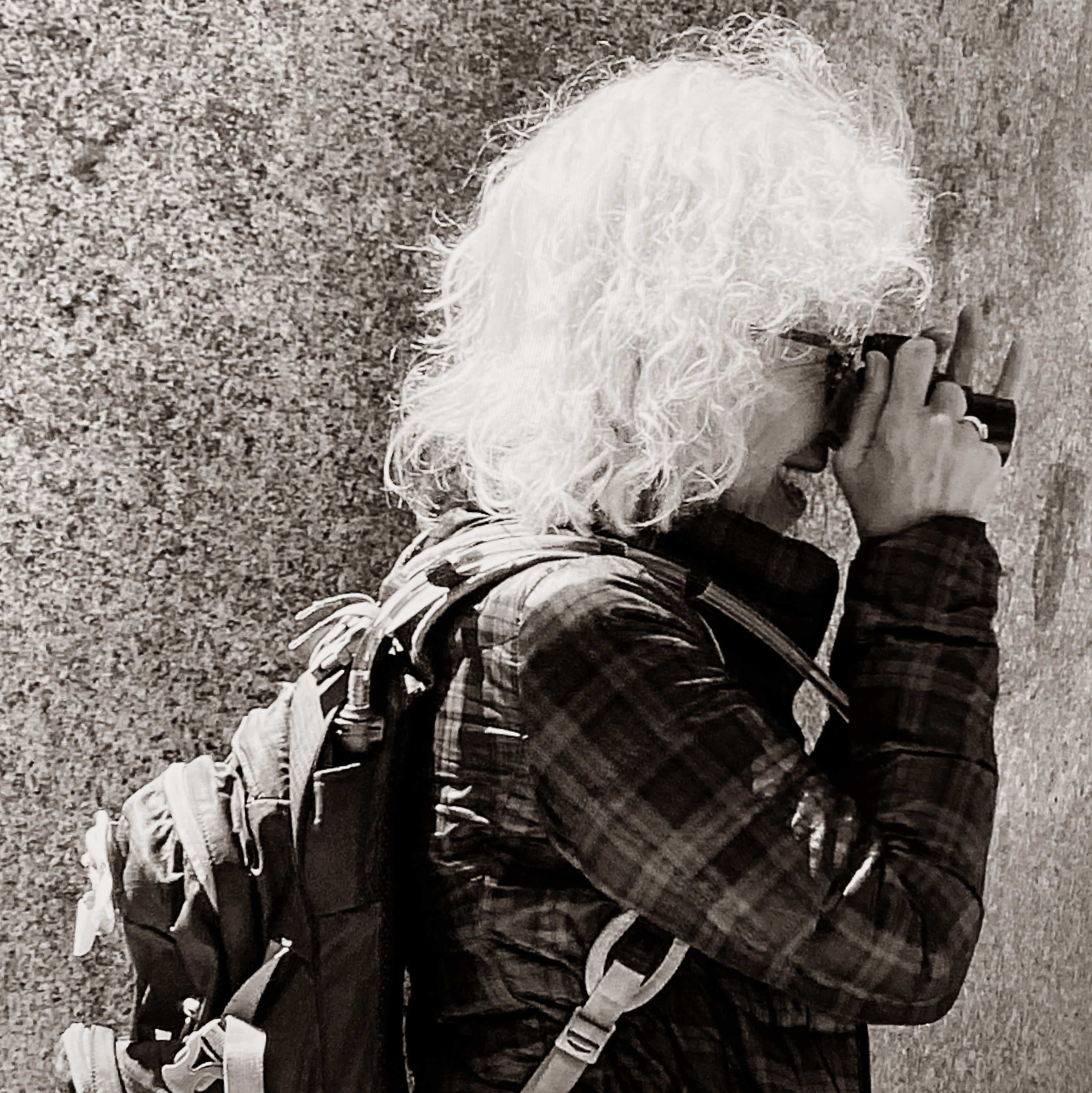 Donna Bassin photographing with camera as artist portrait